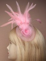 Crystal Innovation-4290 Pink Net Rosette fascinator with feather detail on a clip and brooch pin.