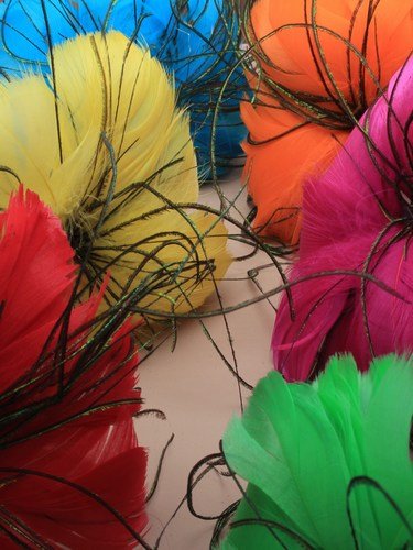 brightly coloured dome feather fasciantor on an aliceband. in pink/yellow/orange/green/red and turq.[Turquoise]