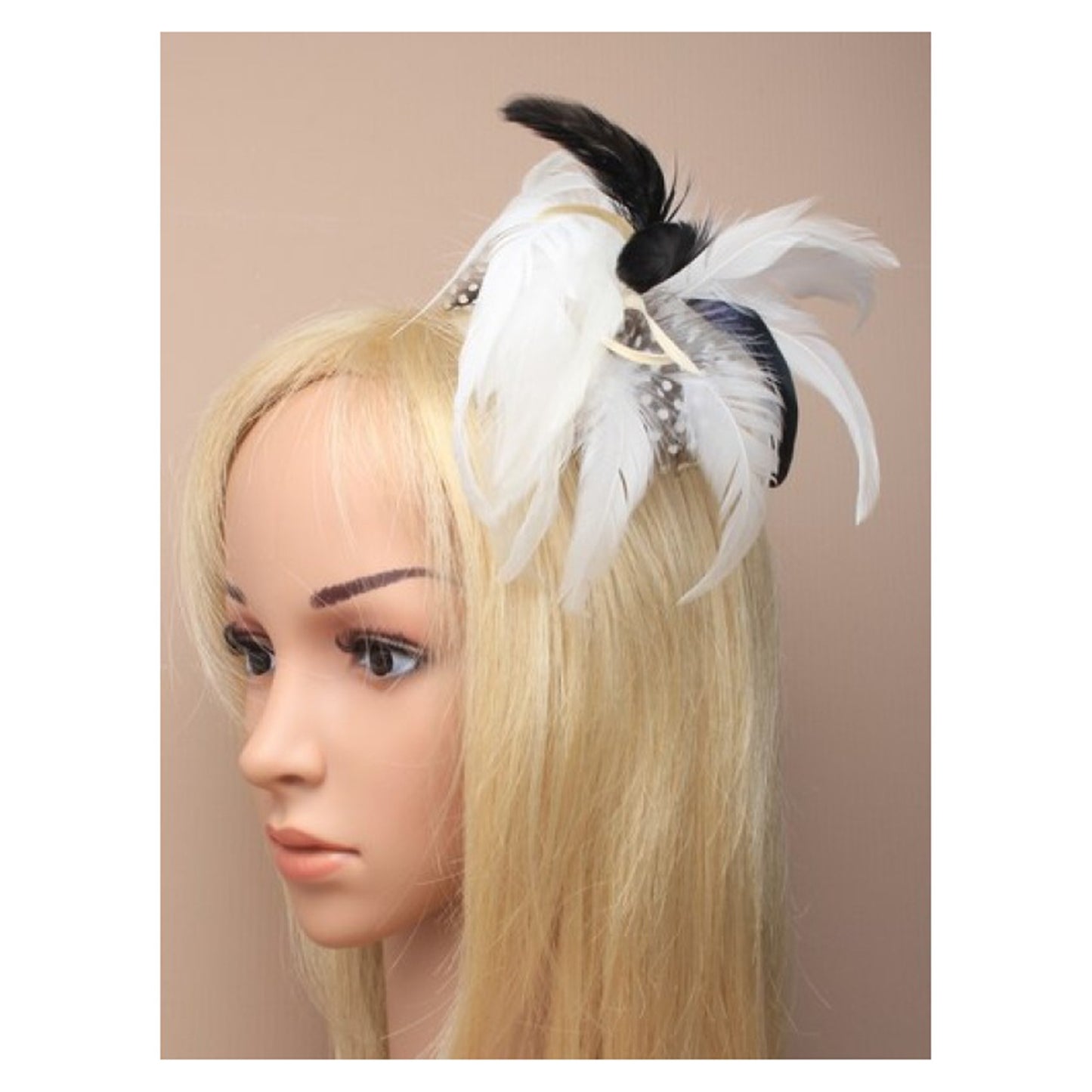 Feather fascinator on a forked clip with brooch pin. In Cream. Style Primrose.